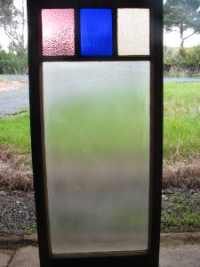 Leadlight stained glass Whangarei. Square design stained glass in a rectangular frame