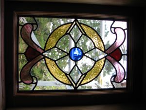 Leadlight stained glass Whangarei. Four directional stained glass design with diamond shaped clear glass