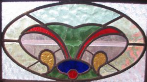 Leadlight stained glass Whangarei. Oval stained glass design. Red green blue yellow and clear glass